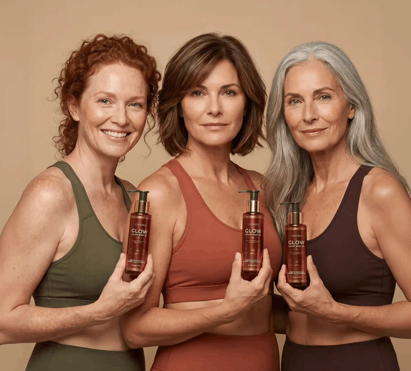 Three women holding Cheemex Glow Luxury Body Oil